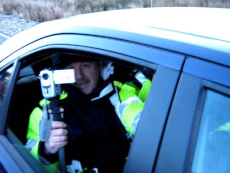 Click on image to see full-sized version 2007 Garda anti-war protest surveillance forgets a tripod needs a stable surface.