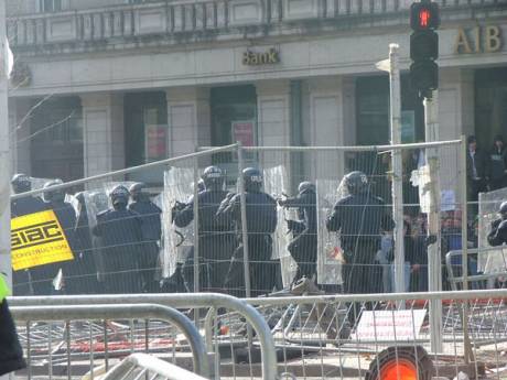 Click on image to see full-sized version Riot Police Advance Through the Building Site