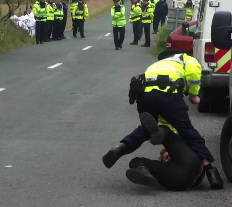 Click on image to see full-sized version Cops assaulting people on the road