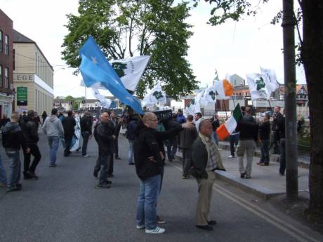 Click on image to see full-sized version 32CSM protestors carrying coffin of the British Empire. The cops wanted to seize this prop...