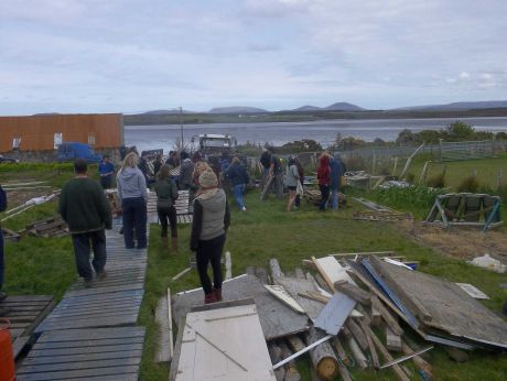 Click on image to see full-sized version Lots of people moving pallets